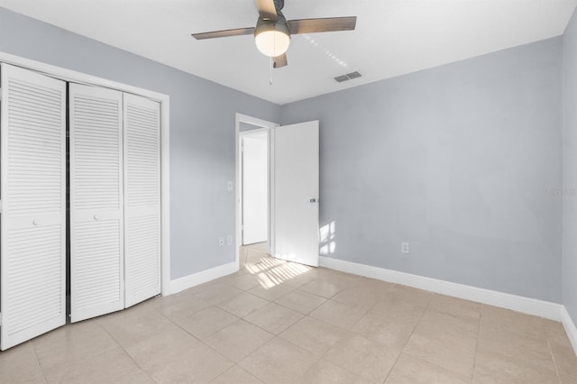 unfurnished bedroom featuring a closet and ceiling fan