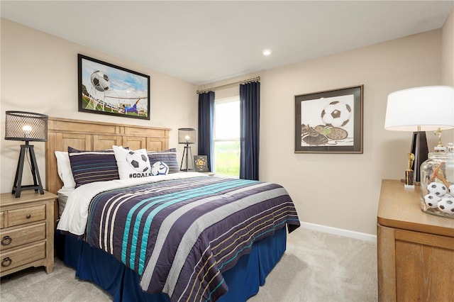 bedroom featuring light colored carpet