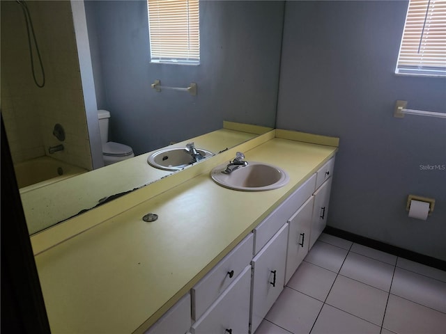 full bathroom featuring toilet, shower / bath combination, tile patterned floors, and vanity