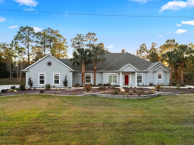 ranch-style home featuring a front lawn