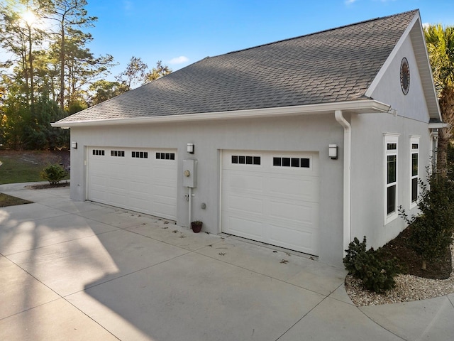 view of side of home with a garage