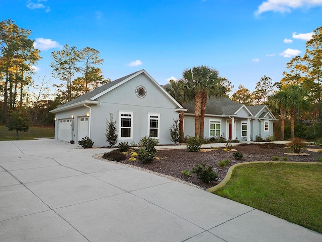 ranch-style house with a front yard and a garage