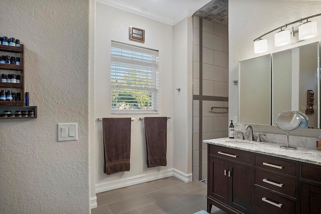 bathroom with vanity and ornamental molding