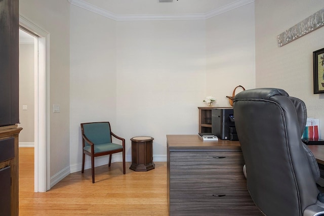 office space with crown molding and light wood-type flooring