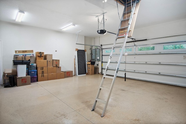 garage with electric panel and a garage door opener