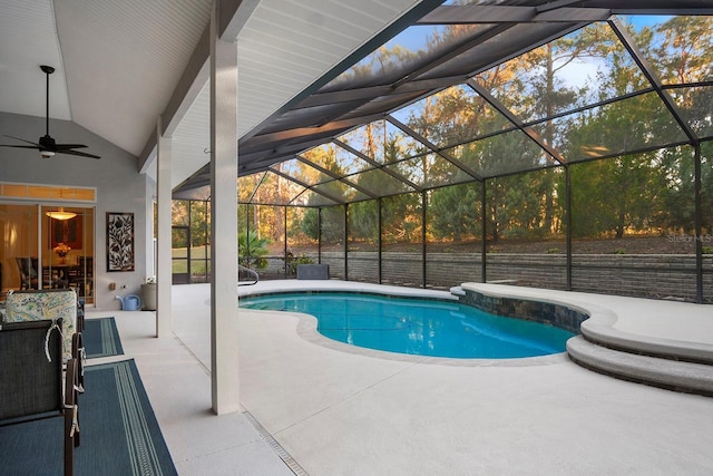 view of pool with a patio, ceiling fan, and a lanai