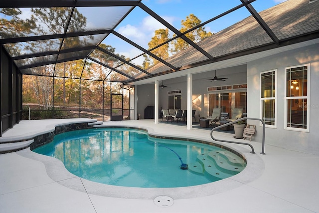 view of pool with a lanai, a patio area, and ceiling fan