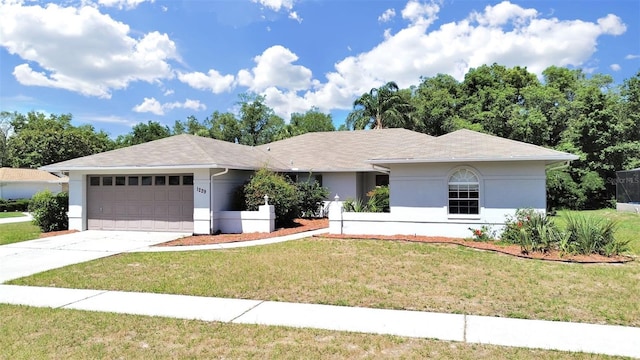 ranch-style home with a garage and a front yard