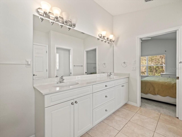 bathroom with tile patterned flooring and vanity