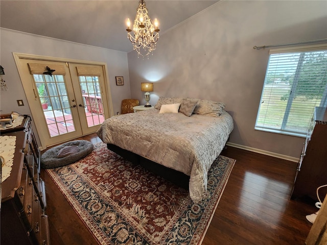 bedroom featuring access to outside, multiple windows, french doors, and dark wood-type flooring