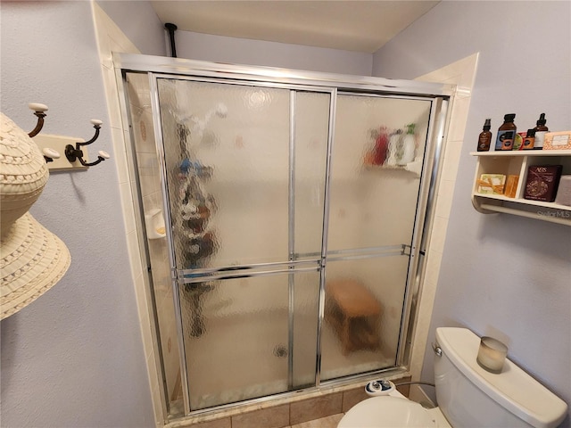 bathroom with toilet and walk in shower