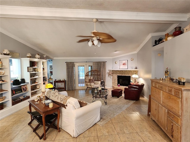 tiled living room with french doors, lofted ceiling, ceiling fan, and ornamental molding