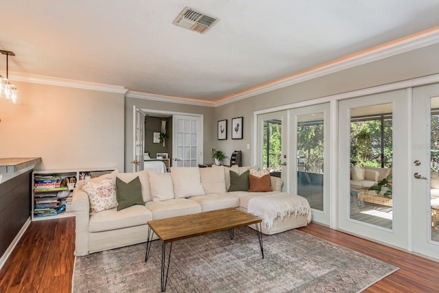 living room with french doors, dark hardwood / wood-style flooring, and ornamental molding