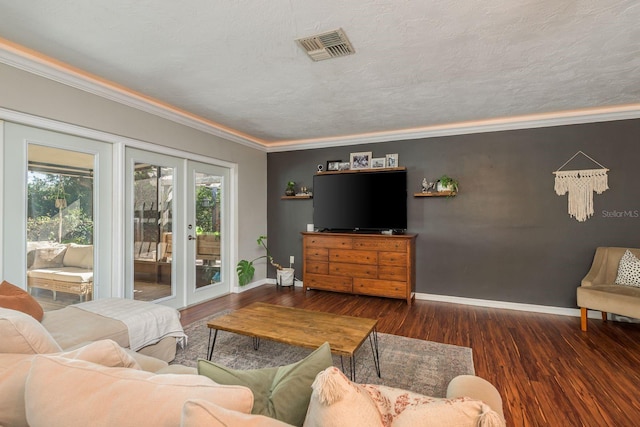 living room with crown molding, french doors, dark wood-type flooring, and a textured ceiling