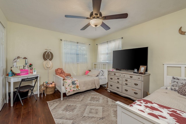 bedroom featuring dark hardwood / wood-style flooring and ceiling fan