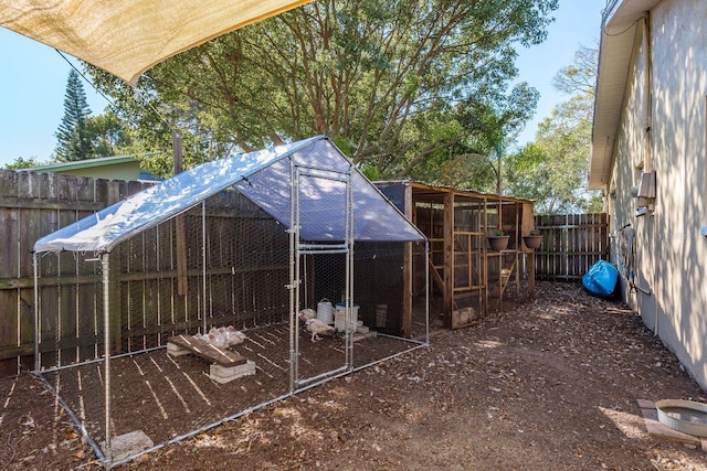 rear view of property with an outbuilding