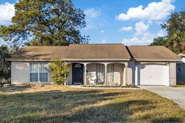 single story home featuring a garage and a front yard