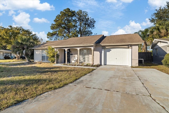 single story home featuring a front yard and a garage