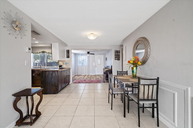 interior space with ceiling fan