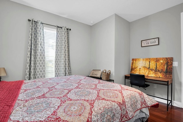 bedroom featuring dark hardwood / wood-style flooring