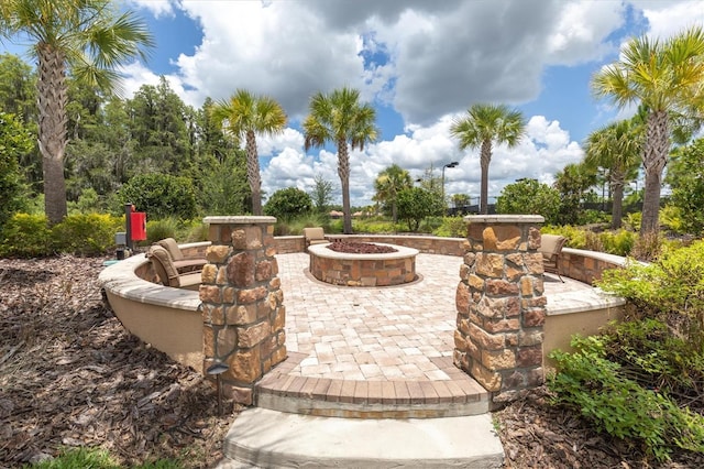 view of patio with a fire pit