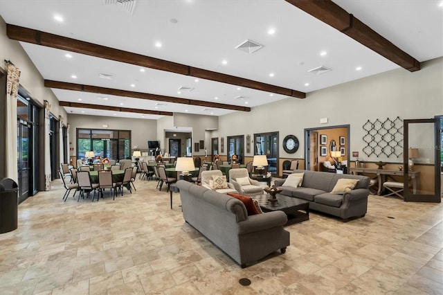 living room featuring beam ceiling