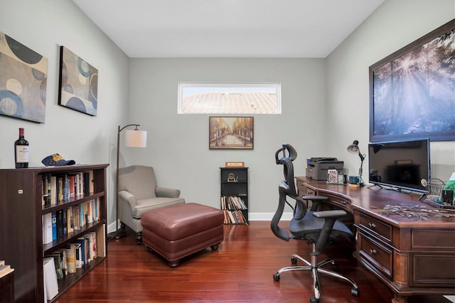 office area with baseboards and wood finished floors