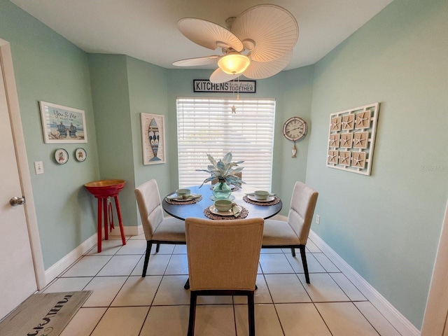 tiled dining room with ceiling fan