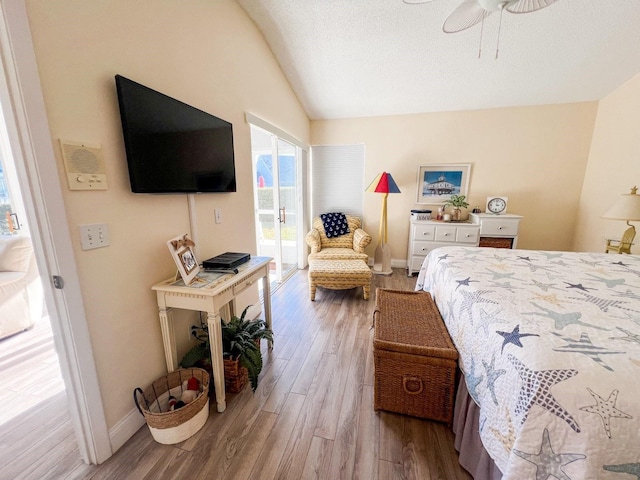 bedroom with light wood-type flooring, ceiling fan, and lofted ceiling