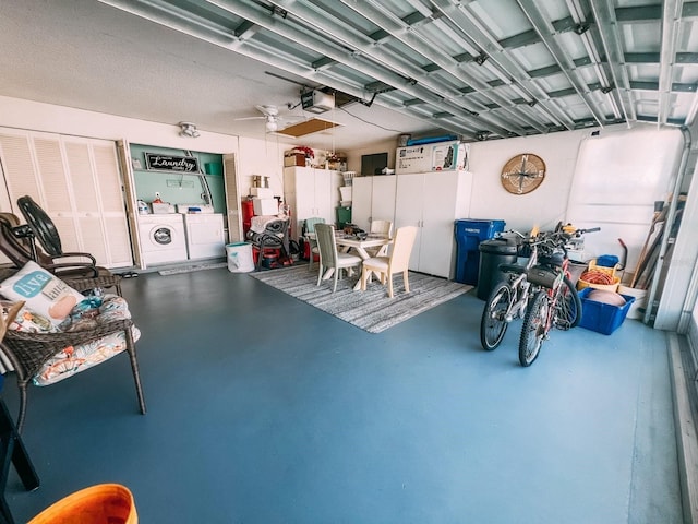 garage featuring a garage door opener and washer and clothes dryer