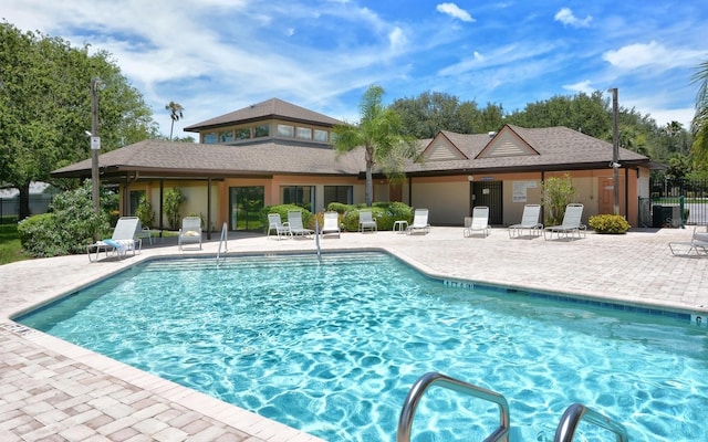 view of swimming pool featuring a patio area