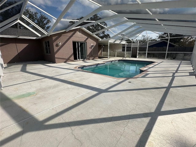 view of pool featuring a lanai and a patio