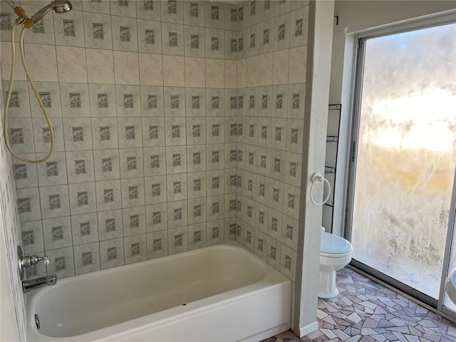 bathroom featuring tile patterned floors, shower / bathing tub combination, and toilet