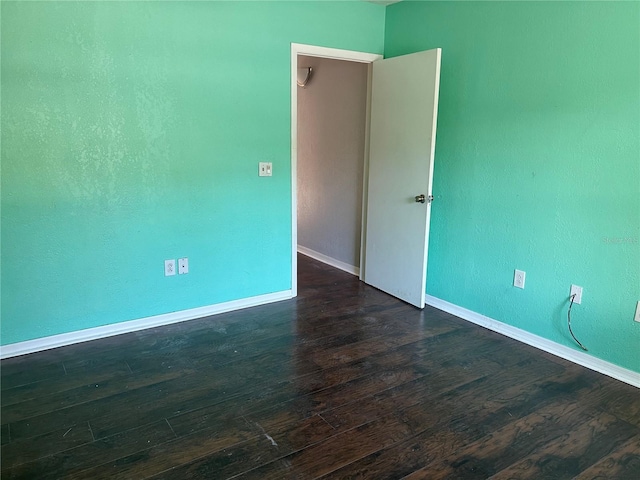 empty room featuring dark hardwood / wood-style floors