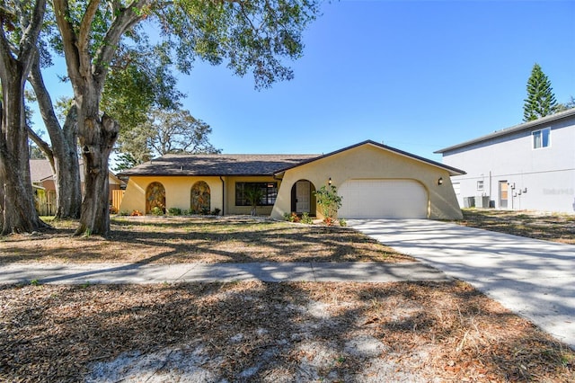 ranch-style home featuring a garage