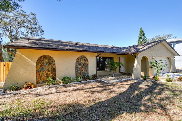 ranch-style home with a garage