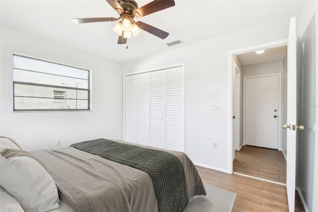 bedroom with a closet and ceiling fan