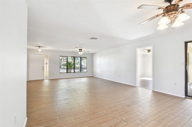 spare room with ceiling fan