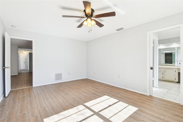 spare room with ceiling fan