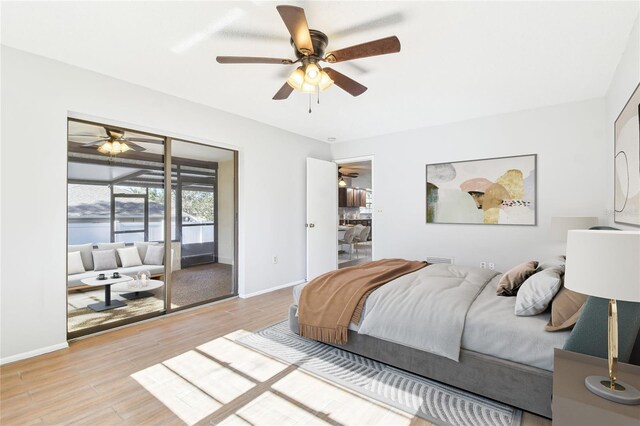 bedroom with ceiling fan, access to exterior, and wood-type flooring