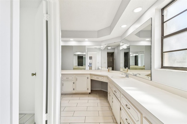 bathroom featuring tile patterned flooring and vanity