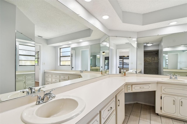 bathroom featuring vanity and a textured ceiling