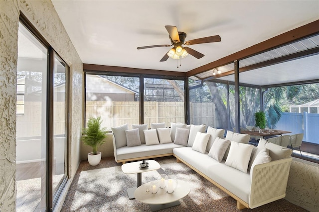 sunroom with ceiling fan