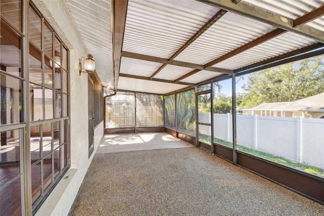 unfurnished sunroom featuring a wealth of natural light