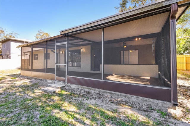 rear view of house with a sunroom