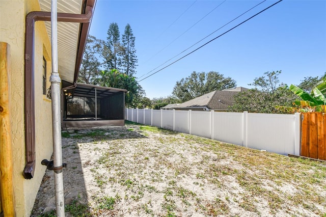 view of yard with a sunroom