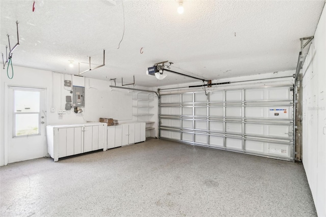 garage featuring a garage door opener and electric panel