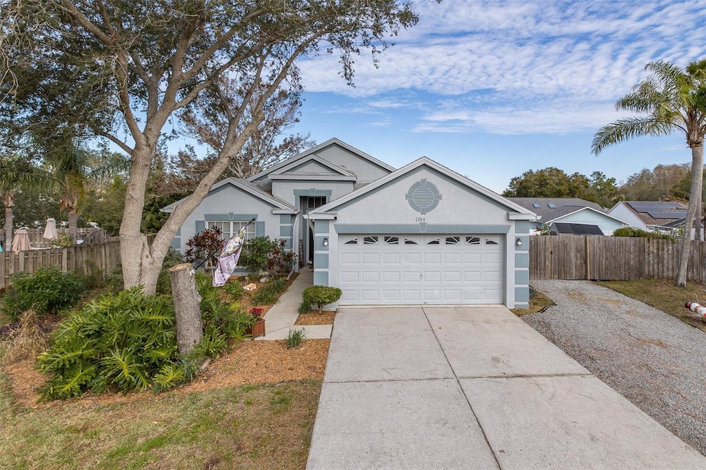 ranch-style house featuring a garage