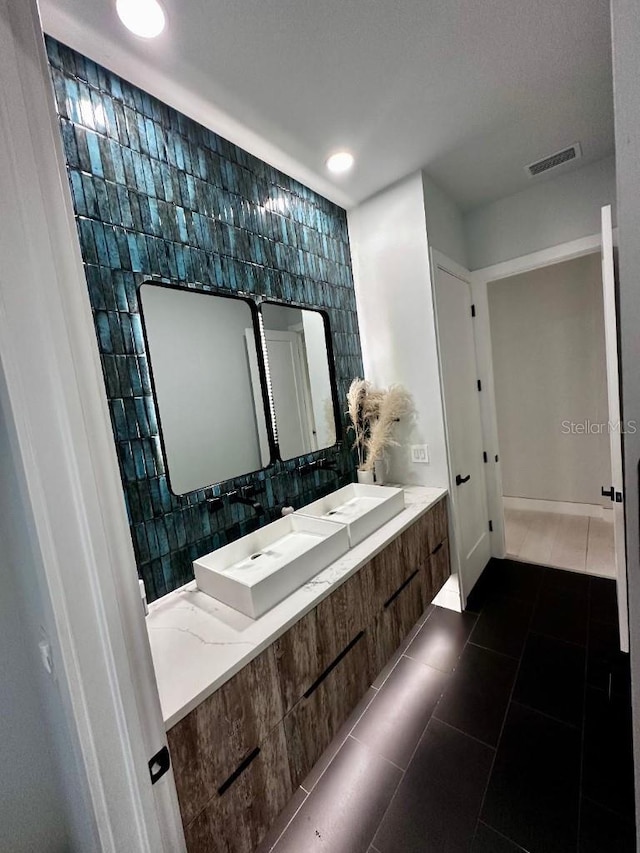 bathroom featuring tile patterned floors and vanity