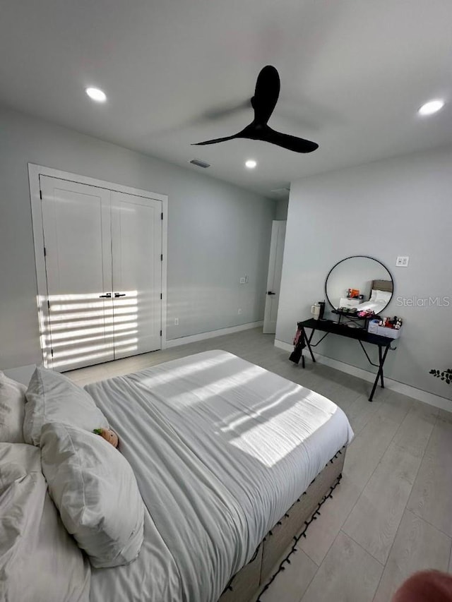 bedroom featuring ceiling fan and light hardwood / wood-style floors